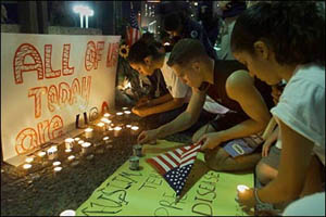 US Embassy in Tel Aviv - placard outside with Israelis lighting candles